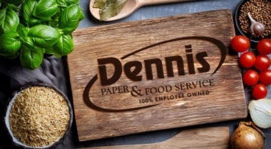 dennis logo on cutting board
