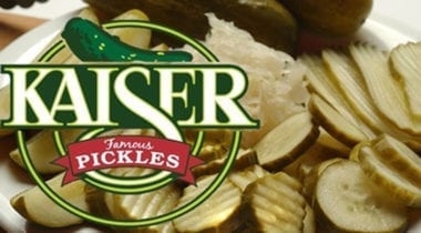 kaiser pickles logo over ridged pickle chips