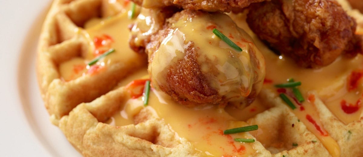 fried chicken on waffles with sauce