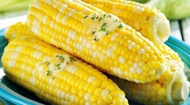 cooked corn on the cob with melted butter