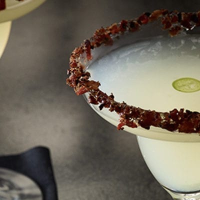 margarita with jalapeno slice floating in it and bacon on the rim. mmm, bacon