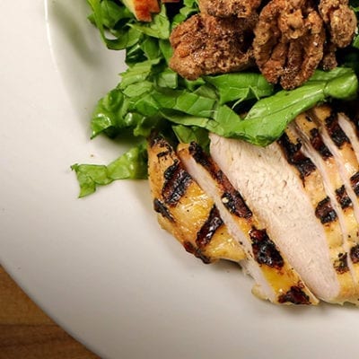 sliced grilled chicken with salad