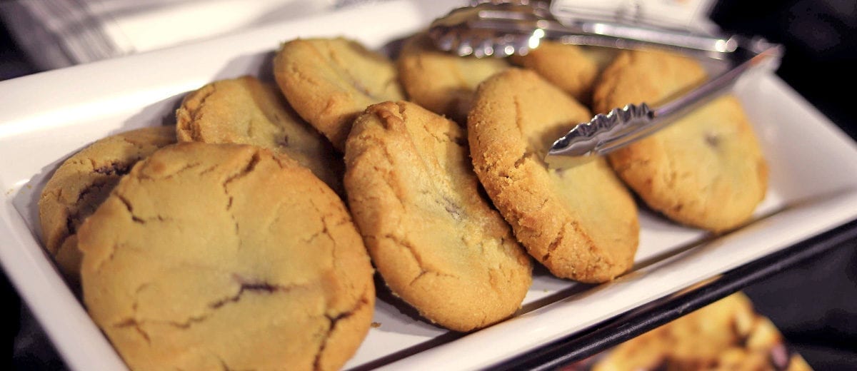 cookies on platter with tongs
