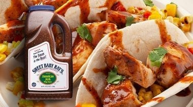 fish tacos and bottle of jamaican jerk sauce