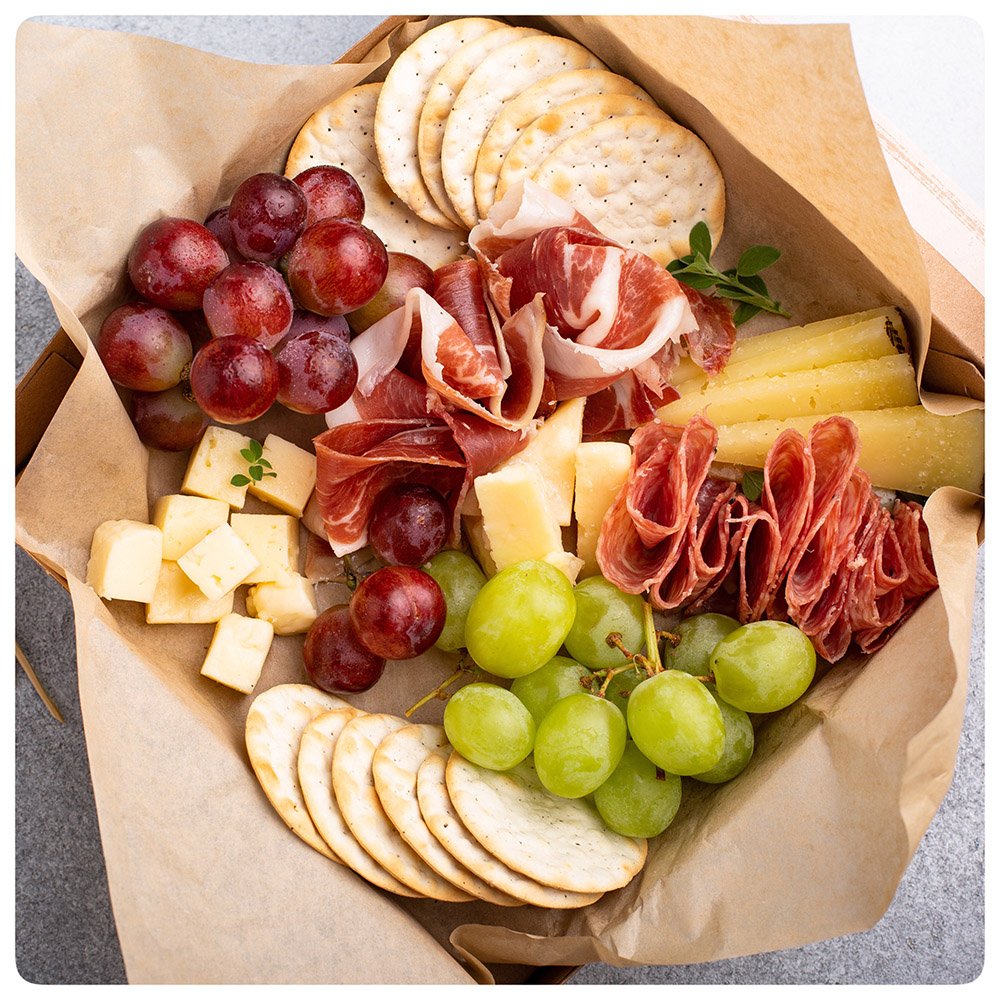 charcuterie in takeout container