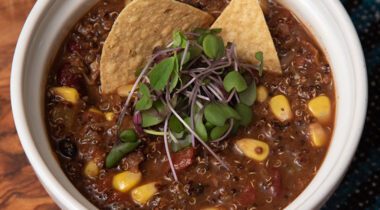 chili with corn, greens, chips